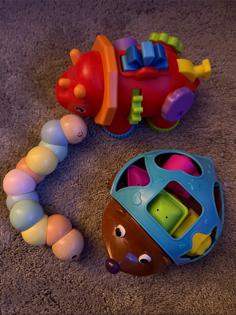 Two learning resource toys and a wood caterpillar